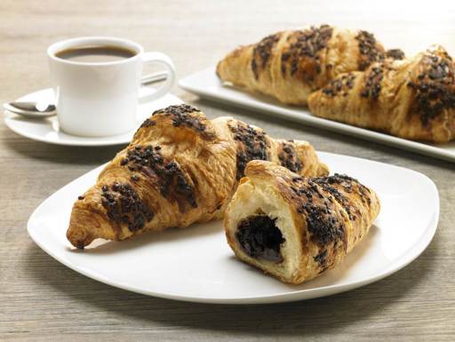 Schulstad Chocolate Hazelnut Filled Croissants with sweet chocolate and hazelnut ganache wrapped in 16 layers of pastry dough, topped with chocolate