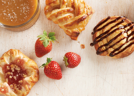Mini Signature Selection of Danish Pastries including cherry chocolate swirl, strawberry shortcake crown, and salted caramel plait